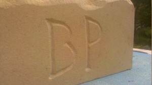 Initials bp on sandstone